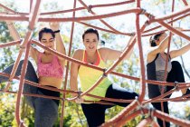 Friends rope climbing in park, close-up view — Stock Photo