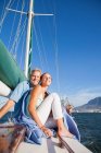 Couple on yacht with wine — Stock Photo