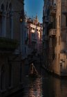 Gondola in a narrow channel of Venice, Italy — Stock Photo
