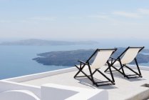 Deckchairs, Imerovigli, Santorini, Greece — Stock Photo