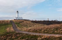 Road leading to lighthouse, Flamborough Head, UK — Stock Photo