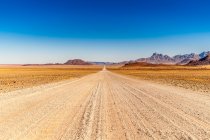Road ahead from Windhoek to Walwedans in the Namibrand Nature Reserve — Fotografia de Stock