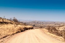 Dirt road from Windhoek to Walwedans in the Namibrand Nature Reserve — стоковое фото