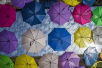 Art installation with colourful umbrellas in a street in Arles — Stock Photo