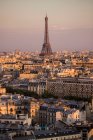 Elevated cityscape of rooftops and Eiffel Tower, Paris, France — Stock Photo