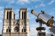 View of Notre Dame cathedral and coin operated telescope, Paris — Stock Photo