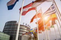 Flags of member states, European Parliament in background, Strasbourg, France — Stock Photo