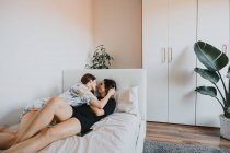 Two lesbian women kissing in the room — Stock Photo