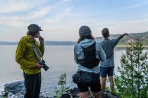 Hikers looking out over water, Ontario, Canada — Stock Photo