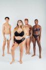 Four young men and women wearing underwear — Stock Photo