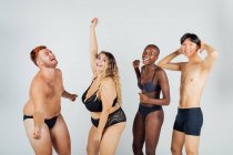 Group of young people dancing, wearing underwear — Stock Photo