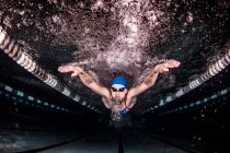 College elite swimmer in swimming pool — Stock Photo
