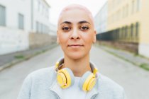 Head and should portrait of young woman with headphones — Stock Photo