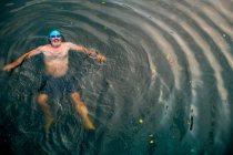 Man wild swimming in river, overhead view, River Wey, Surrey, UK — Stock Photo