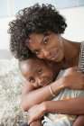 Portrait of mother hugging son — Stock Photo