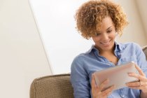 Young woman reading electronic book — Stock Photo