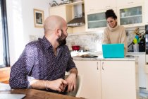 Young couple in kitchen at home — Stock Photo