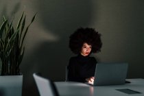Businesswoman working late in office — Stock Photo