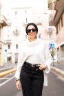 Street portrait of stylish young woman, wearing sunglasses — Stock Photo