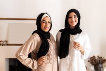 Portrait of female friends wearing hijab — Stock Photo