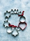 Wreath of metal cookie cutters — Stock Photo