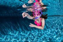 Little girl diving and swimming pool, close-up view — Stock Photo