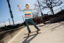 USA, California, Big Sur, Boy skateboarding in skate park — стокове фото