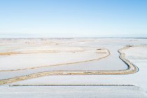 Netherlands, Broek, Aerial view of snow covered fields and canal — Stock Photo