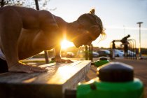 Spain, Mallorca, Man doing push-ups at outdoor gym — Stock Photo