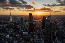 UK, London, High angle view of City of London skyscrapers at sunset — Stock Photo