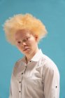 Studio portrait of albino woman in white shirt — Stock Photo