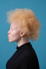 Studio portrait of albino woman with eyes closed — Stock Photo