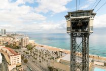 Spain, Barcelona, Barcelona's Port cable car tower and coast — Stock Photo