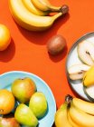 Overhead view of fruits on plates — Stock Photo