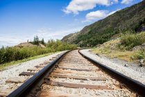 USA, Alaska, Railroad track in mountains — Stock Photo