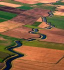 UK, Lytham St. Annes, Aerial view of river mederingthroughfields — стокове фото