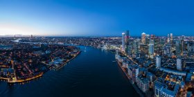 UK, London, Aerial view of Canary Wharf and Thames river at night — Stock Photo