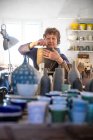 Spain, Baleares, Woman making ceramics in workshop — Stock Photo