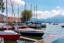 Austria, Boats moored at pier on Mondsee — Stock Photo