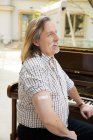 Austria, Portrait of pianist with adhesive bandage on arm — стокове фото