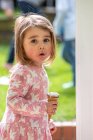 UK, Portrait of girl (2-3) with ice cream cone — Stock Photo