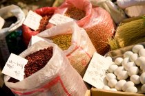China, Shanghai, Close-up of bags of beans and eggs on farmers market — Stock Photo