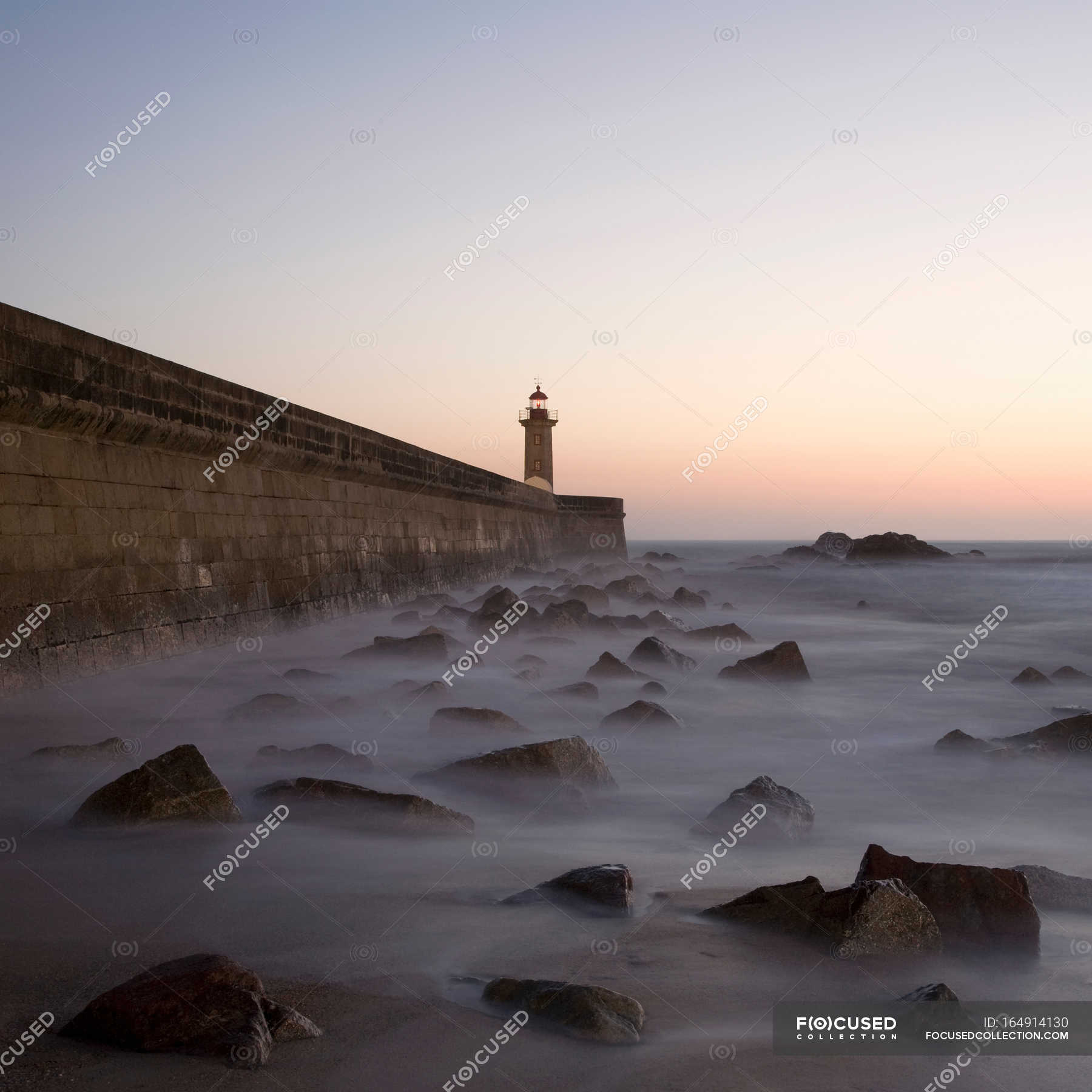 Sunset at lighthouse at foggy weather — mystery, long exposure - Stock ...