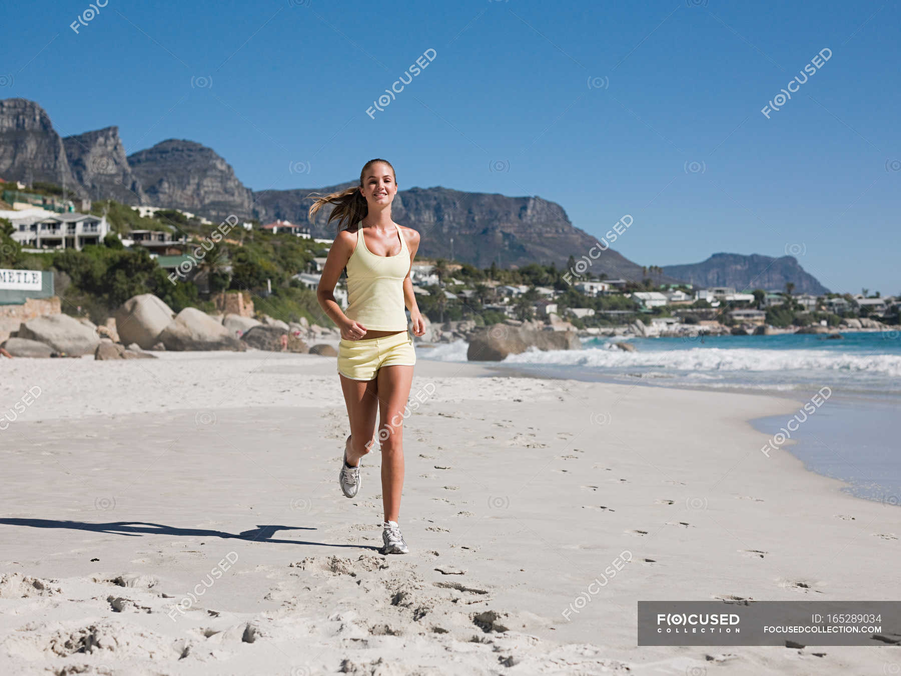 Young woman jogging on beach — Exercising, daytime - Stock Photo ...