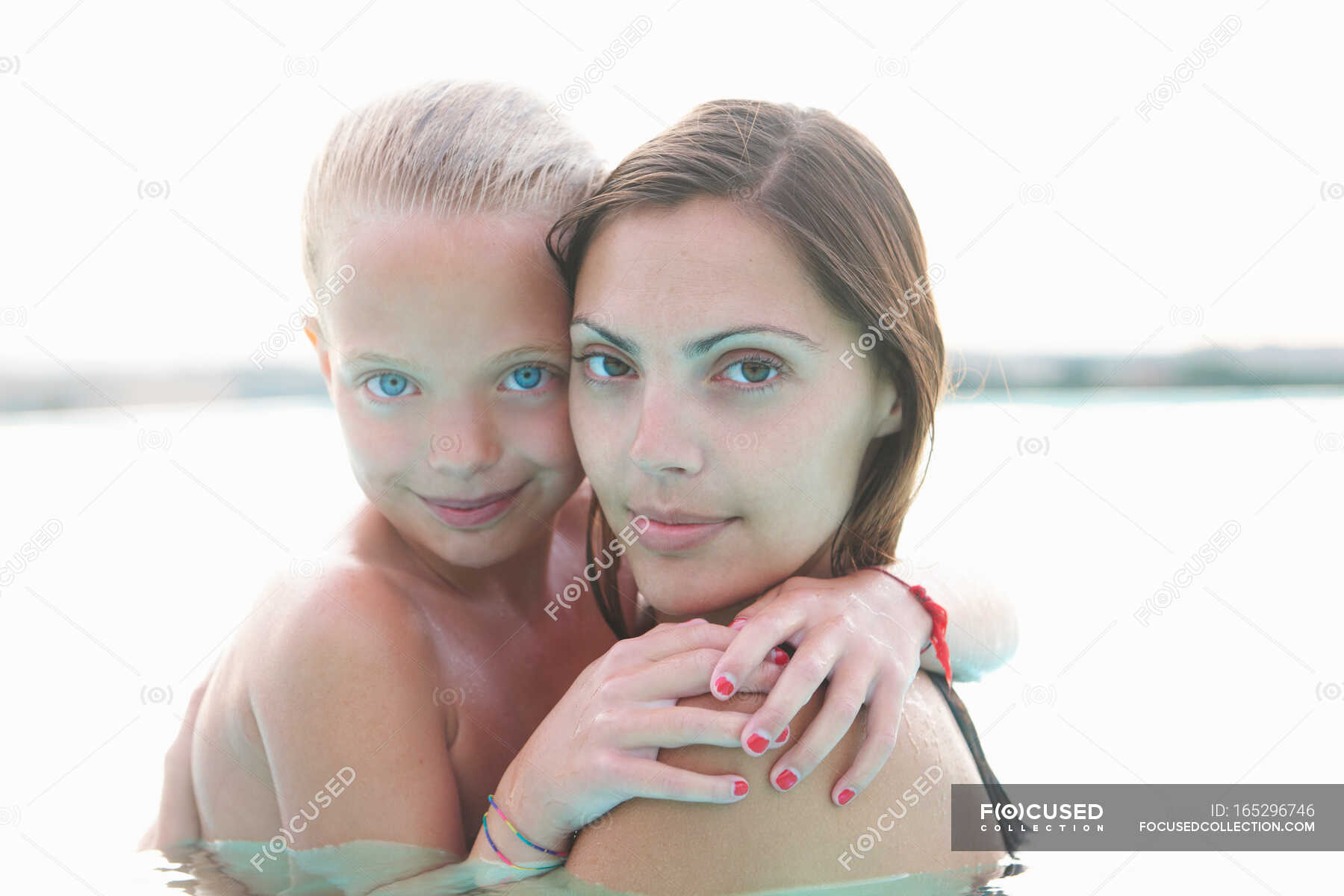 Portrait Of Mother And Daughter In Outdoor Swimming Pool — Two People 30 To 34 Years Stock 2241