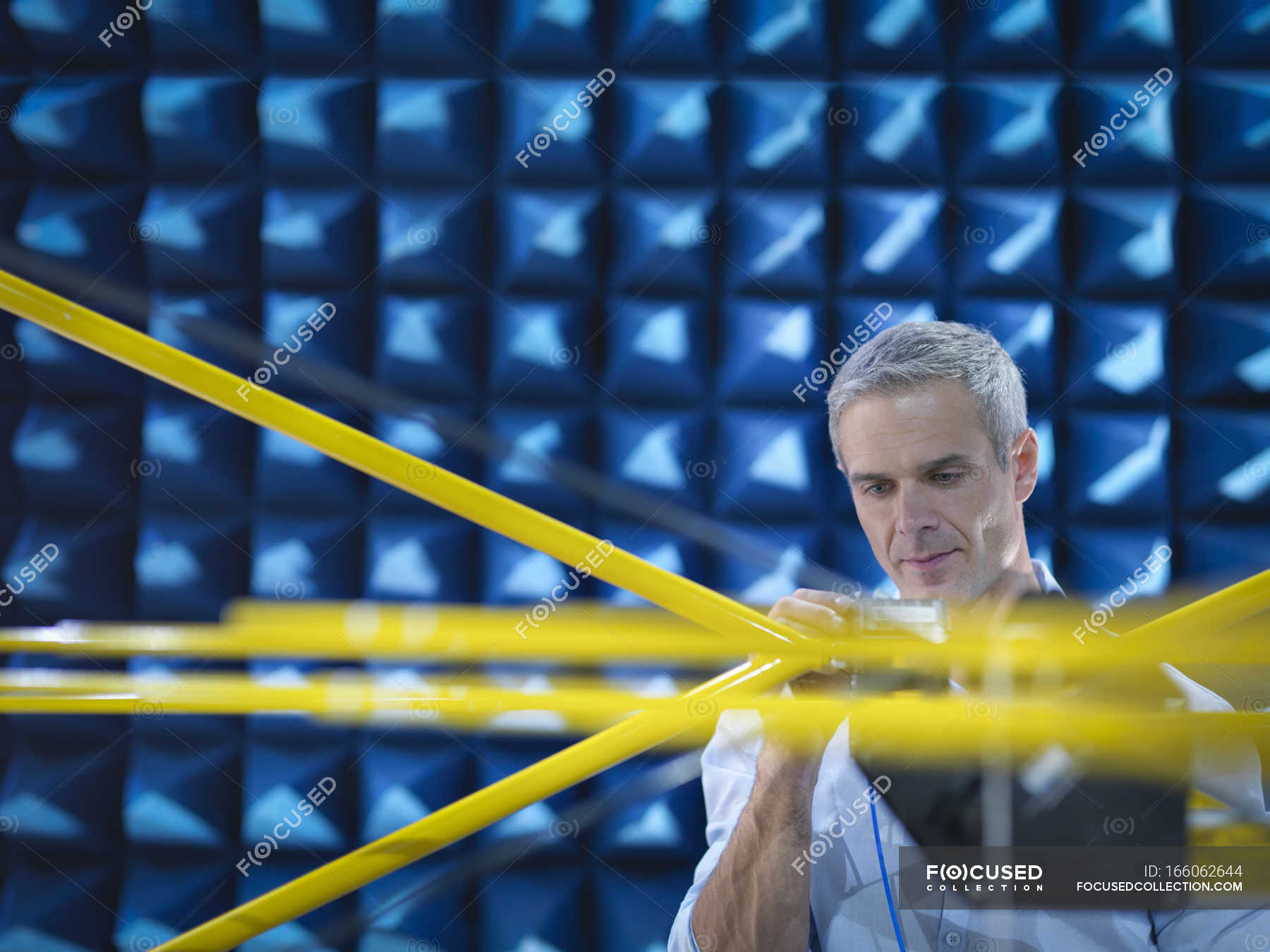 scientist-preparing-to-measure-electromagnetic-waves-in-anechoic