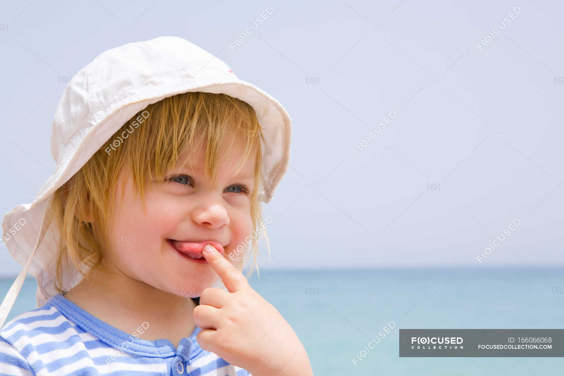 Portrait of baby at beach with tongue out — fun, day - Stock Photo ...