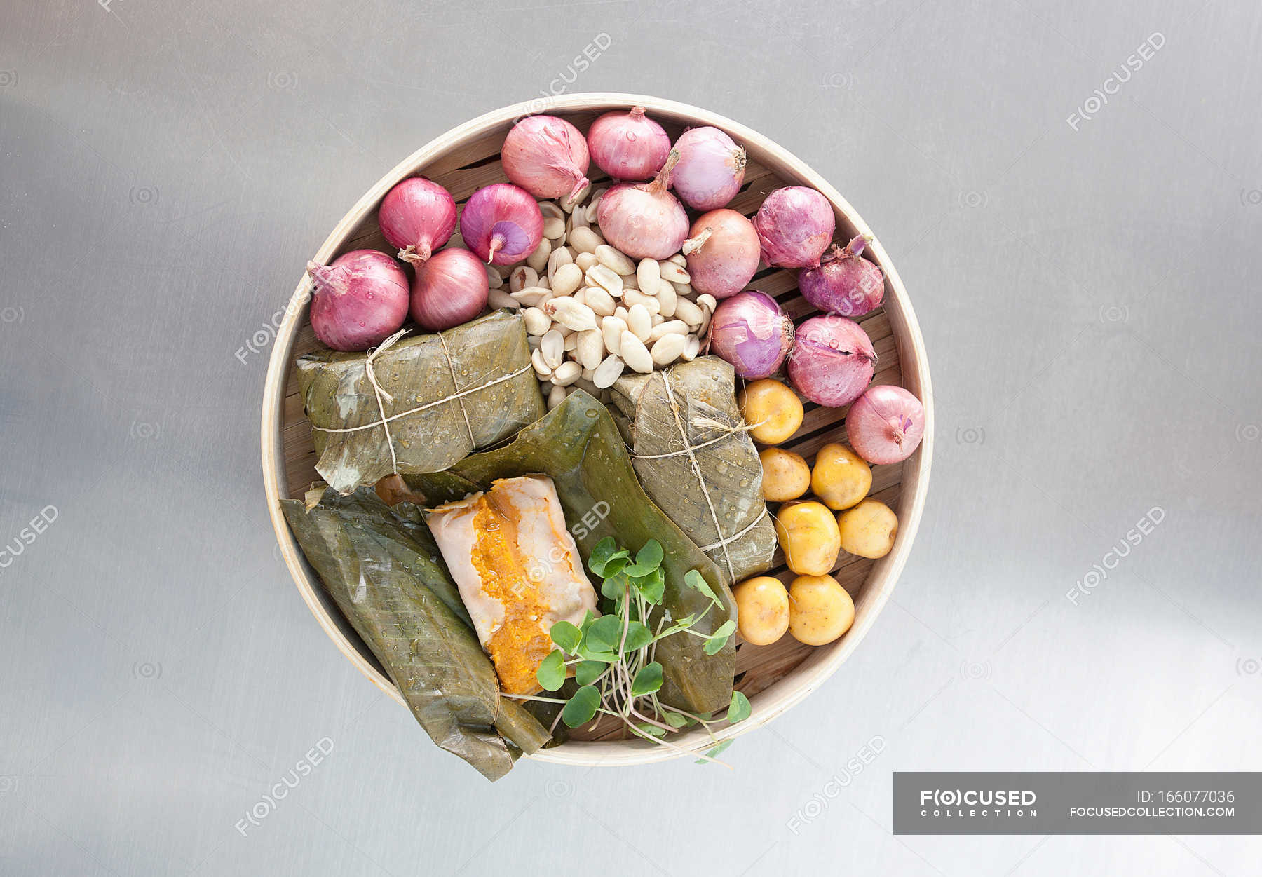 Tamales wrapped in banana leaves with vegetables — cooking, High Angle ...