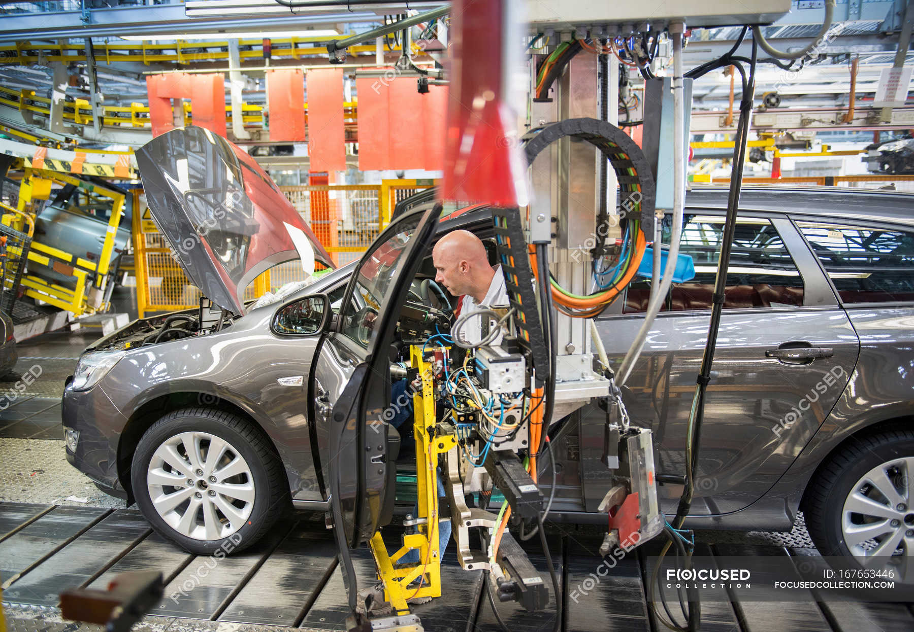 Car Embly Workers Ing Doors To Cars On Production