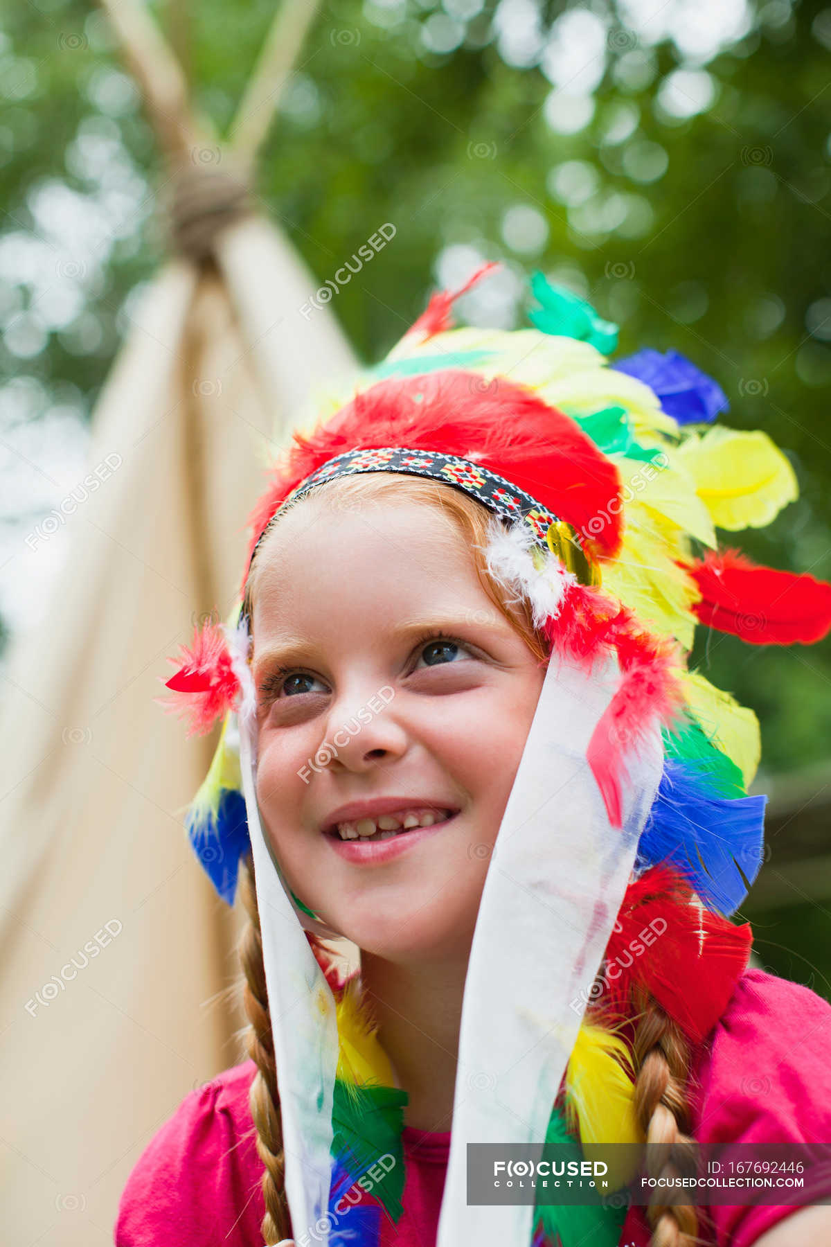 girl-wearing-indian-headdress-summer-outdoors-stock-photo-167692446